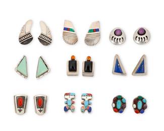 2296 A group of Southwest silver and set stone earrings Late 20th/21st century Six marked for sterling; five variously marked for maker: Ray Bennett [Navajo/Diné] / RB [for Richard or Rita Begay, Navajo/Diné] / TC / EMT [within a fish; for Everett & Mary Teller, Navajo/Diné] / S// [possibly Dean Sandoval, Jr, Navajo/Diné] Nine pairs of earrings in various styles and motifs most with set stones including turquoise, coral, onyx, amber, lapis lazuli, and mother of pearl, in various styles including bezel set, silver overlay, channel inlay, shadowbox, and figural mosaic stone inlay 18 pieces Largest: 1.75" H; Smallest: 1.125" H 115.8 grams gross Estimate: $400 - $600
