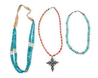 2223 A group of Southwest turquoise and coral bead jewelry Mid/late 20th century Unmarked Comprising a single strand turquoise and coral bead necklace suspending a silver two-sided cross pendant with row set turquoise and coral (22.5" L x 3" H), together with a double strand necklace formed of two turquoise, shell and coral jaclas, with a leather neckpiece (29" L), and a single strand necklace of turquoise disc and silver beads (20.5" L) 3 pieces 243.5 grams gross Estimate: $300 - $500