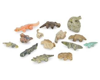 2320 A group of fourteen Zuni carved reptile and scorpion fetishes Mid/late 20th century, mostly Zuni Pueblo Some variously incised with signature, initials, or artist's cipher From artists including Tyler Quam, Avriel Lamy, Nelson Yatsattie, and Emery Eriacho, carved from hardstone, turquoise, or bone; most with turquoise, jet, or coral eyes and accents 14 pieces Tallest: 2.25" H x 1.875" W x 1.25" D; Smallest: 1" H x 1.25" W x 0.75" D Estimate: $200 - $400