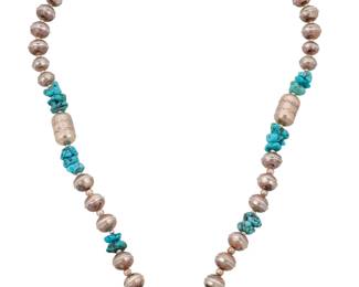 2048 A Tommy Singer Navajo sterling silver bead and turquoise necklace Thomas "Tommy" Singer (1940-201, Diné) Late 20th/21st century Stamped: Thomas Singer / Sterling A chunky necklace of alternating nugget turquoise, sterling silver round and barrel beads with stampwork accents, and with set turquoise to clasps 32.5" L x 0.75" Dia. 116.4 grams gross Estimate: $600 - $800