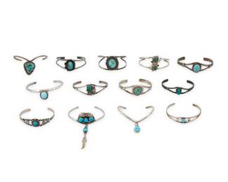 2300 A group of Southwest silver and turquoise bracelets Mid/late 20th century Variously marked for maker and for sterling: P [Prince Trading Post] / A [conjoined] / R. Francisco [script] / [signpost for Bell Trading Post] A group of silver wire cuffs in various styles and sizes, including bezel set, some with rope wire accents, some with silver overlay feather accents, and some with stamp work, each with set stones including turquoise and malachite, and two with a turquoise dangle 13 pieces Largest: 7" inner C x 0.875" H; Smallest: 6" inner C x 0.5" H 153.9 grams gross Estimate: $300 - $500