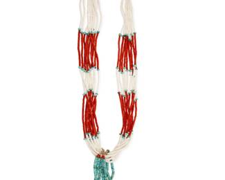 2169 A Pueblo style turquoise and coral necklace Mid/late 20th century Unmarked Comprising a ten-strand necklace with alternating coral, white shell heishi, and turquoise beads, all suspending two pairs of turquoise, spiny oyster and coral jaclas 32" L x 5.75" H 238.8 grams gross Estimate: $500 - $700