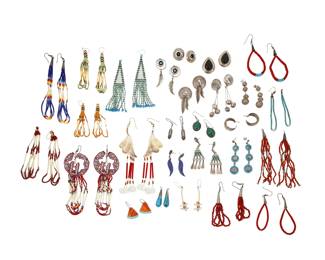 2313 A group of Southwest style silver and beadwork earrings Mid/late 20th century Three variously marked for artist and for sterling: B Chee A large group comprising multiple pairs of silver and set stone earrings in various styles including turquoise, malachite, onyx, and lapis lazuli, some with stamped feather or bead dangles, as well as multiple pairs of beaded and beadwork earrings in multicolored beads of glass, shell, turquoise, coral, quill, and carved stone fetish beads 54 pieces approximately Largest: 6" H; smallest: 0.875" H 201.2 grams gross Estimate: $200 - $400