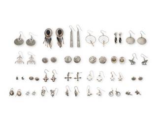 2305 A large group of Southwest style silver earrings Mid/late 20th century Many variously marked for sterling; some for maker: AJM / Twenty-six pairs of silver earrings in various styles and sizes including pictorial, conchos, 'Man in a Maze', totem poles, cross motifs, dreamcatchers, wolves, donkeys, canoes, Kokopelli, katsinas, bears, lizards, and cowboy hats 52 pieces Largest: 3" H; Smallest: 0.375" H 90.6 grams gross Estimate: $200 - $400