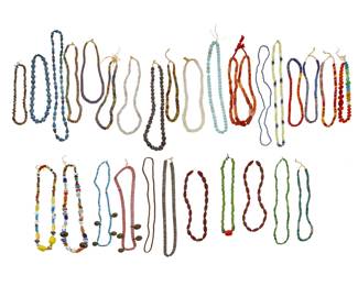 2316 A large group of trade bead necklaces and strands 20th century Comprising multiple strands and necklaces of various colors and types of beads including glass, ceramic, millefiori beads, striped ceramic beads, and metal discs, of various origins including Italian, African, and Native American-style beads 29 pieces Largest: 38" L; Smallest: 19" L 3509.5 grams gross Estimate: $200 - $400