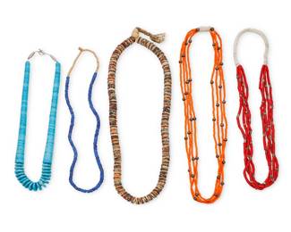 2212 A group of Southwest style bead necklaces 20th century Unmarked Comprising a graduated blue stone turquoise-colored necklace with glass bead spacers (25" L), a four-strand red bead necklace with scattered silver metal and green stone beads and a traditional wrapped neck cord (26" L), a four-strand orange bead necklace with silver metal beads (29" L), a single strand of faceted blue glass trade beads, possibly Russian, (26" L), and a chunky necklace of round bone disc beads with beadwork accents, possibly North African (29" L) 5 pieces 406.1 grams gross Estimate: $200 - $400
