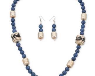 2050 A set of Navajo sterling silver and hardstone bead jewelry, attributed to Thomas Singer Attributed to Thomas 'Tommy' Singer (1940-2014, Diné) Late 20th/21st century Unmarked, consignor's tag indicates maker A chunky necklace of blue hardstone beads and large sterling silver barrel beads with geometric silver overlay motifs, together with a pair of matching earrings 3 pieces Necklace: 30.5" L x 1" Dia.; Earrings: 3" H 204.3 grams gross Estimate: $600 - $800