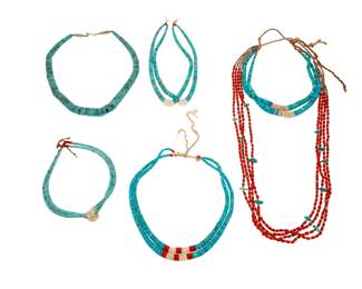2218 A group of Pueblo turquoise necklaces Mid-20th century Unmarked Five works comprising a graduated turquoise bead necklace with silver clasp, as well as a four-strand white heishi shell and red bead necklace suspending a pair of turquoise and shell jaclas, and three additional pairs of turquoise, shell, and coral jaclas 6 pieces Necklaces: 28" L x 7.5" H and 17.75" L; Largest jacla: 7.5" H; Smallest: 6" H 249.7 grams gross Estimate: $400 - $600
