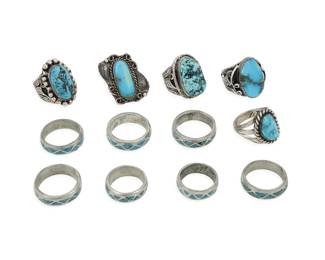 2294 A group of Southwest silver and turquoise rings Mid/late 20th century Variously marked: JR [three for Jerry Roan, Navajo/Diné] / LS [conjoined, stacked] Twelve turquoise rings in various styles and sizes including bezel set with rope wire edging, mosaic chipped inlay, some with applied wire scrolled edging, and four with applied silver feather and stampwork accents 12 pieces Ring sizes: 12 to 5 106.6 grams gross Estimate: $200 - $400