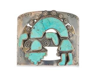 2060 A Federico Jimenez sterling silver and turquoise Rainbow Dancer cuff bracelet Federico Jimenez (b. 1941, Mixtec) Late 20th/21st century Stamped: JF [conjoined] / Sterling The wide openwork cuff with Rainbow Guardian figure in turquoise inlay, and with applied silver accents and stampwork to shoulders 7" total inner C x 2.125" H, gap: 1.125" 91.6 grams gross Estimate: $500 - $700