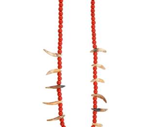 2181 A Plains trade bead and coyote tooth necklace Early 20th century A single strand necklace with red beads alternating with fourteen polished coyote teeth 28" L 93.7 grams Estimate: $200 - $400