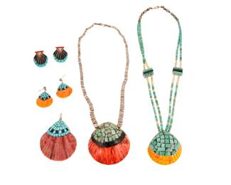 2164 A group of Kewa/Santo Domingo Pueblo style shell jewelry Mid/late 20th century, New Mexico Earrings Five works comprising two shell pendants including one with a double strand of graduated turquoise and stone beads with turquoise and jet spacers, and one with a single strand of graduated shell heishi, each suspending a shell pendant with turquoise mosaic inlay, as well as a single shell and turquoise inlay pendant, and two pairs of similar design earrings, one pair in sterling silver 7 pieces Necklaces: 20" L x 2" H and 18.25" L x 2.5" H; pendant: 3" H x 2.25" W; earrings: 1.5" H and 1.125" H 127.1 grams gross Estimate: $400 - $600