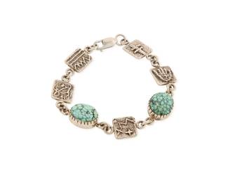 2234 A Harold Lovato Kewa/Santo Domingo sterling silver and turquoise bracelet Harold Lovato (1954-1997, Kewa) Late 20th century Marked: HL A delicate sterling silver link bracelet with set turquoise and sandcast links featuring pictorial and geometric motifs 7" L x 0.5" H 20.9 grams gross Estimate: $300 - $500