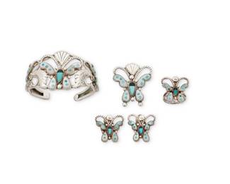 2090 A group of Zuni Pueblo style sterling silver and stone inlay jewelry Mid/late 20th century Unmarked Four works each featuring stylized butterfly motifs in applied and stamped sterling silver with set stone and stone inlay including turquoise, mother of pearl, and onyx, comprising a two wire cuff bracelet, a matching pendant/brooch, a pair of earrings, and a ring 5 pieces Cuff: 6.25" total inner C x 1.5" H, gap: 1"; Brooch: 1.5" H; Earrings: 1" H; Ring size: 7.5 62.5 grams gross Estimate: $500 - $700