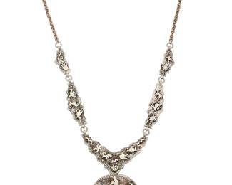 2151 A Herman Vandever Navajo sterling silver pictographic necklace Herman Vandever (b. 1964, Diné) Late 20th/21st century Etched signature verso A five link necklace featuring various pictograph style animal and figural motifs, suspending a matching disc pendant/brooch with central set turquoise cabochon 25" L x 2.125" Dia. 103.3 grams Estimate: $700 - $900