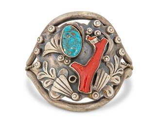 2003 A Southwest sterling silver, turquoise, and coral cuff bracelet Mid-20th century Unmarked A three wire cuff with central sterling plaque with set turquoise and branch coral, with applied silver foliate and dot accents 6.5" total inner C x 2.375" H, gap: 1" 71.4 grams gross Estimate: $600 - $800