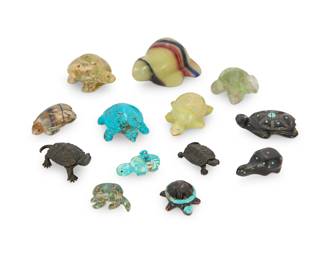 2319 A group of eleven Zuni carved turtle fetishes Mid/late 20th century, mostly Zuni Pueblo Some variously incised with signature, initials, or artist's cipher From artists including Todd Etsate, Georgianne Quandelacy, and a member of the Boone family, carved from hardstone, turquoise, and jet; most with inset turquoise, coral, or jet eyes and accents, one mounted with offerings, together with two cast metal figures/charms 13 pieces total Largest: 1.125" H x 2.125" W x 1.625" D; Smallest: 0.5" H x 1.125" W x 0.75" D Estimate: $200 - $400