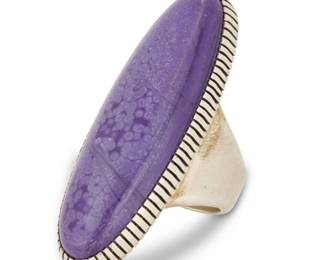 2155 A Herman Vandever Navajo sterling silver and sugilite ring Herman Vandever (b. 1964, Diné) Late 20th/21st century Etched signature verso Featuring a large sterling silver ring with an oval set purple sugilite stone and ridged bezel Ring size: 8.5; 2.125" H 38.5 grams gross Estimate: $200 - $400