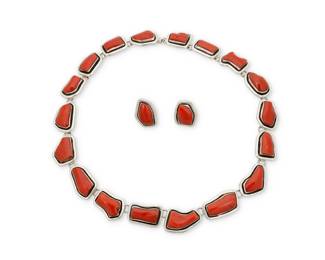 2157 A set of Herman Vandever Navajo sterling silver and coral jewelry Herman Vandever (b. 1964, Diné) Late 20th/21st century Etched signature verso A chunky silver link necklace with graduated irregular shadowbox set coral links, with a pair of matching earrings 3 pieces Necklace: 19" L x 0.75" H; Earrings: 1" H 142.9 grams gross Estimate: $700 - $900