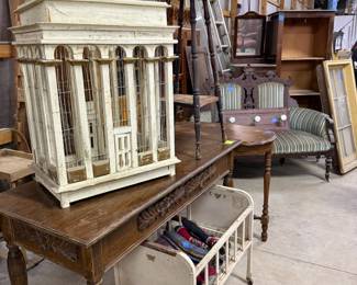 Antique doll, crib, birdhouse tables, and children children’s dressers