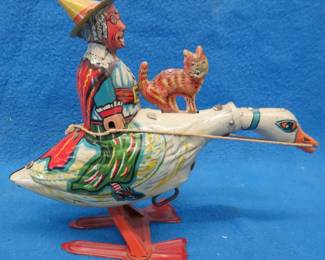 Lot 19. Louis Marx "Old Mother Goose" wind-up toy in working condition. Part of the original box included.