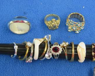 Lot 47. Costume jewelry rings, one ring tested diamonds with rubies or garnet