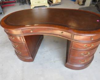 Lot 31. Large office desk in good condition. We believe it is walnut. Bring help to load.