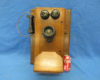 Lot 16. Antique Stromberg Carlson wall mount telephone. Wood case has been refinished.