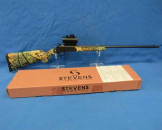 Lot 12. Stevens Model 301 410 shotgun. S/N 22129D. 26" barrel with a Red Dot 1 x 30 scope. Includes original box and manual.