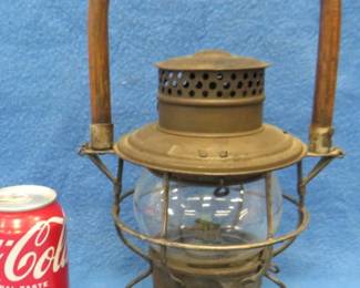 Lot 29. Adlake #250 kerosene lantern with wooden handle and original embossed globe