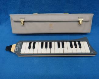 Lot 23. Hohner Melodica Piano harmonica in like-new condition. Includes original case. Made in Germany.
