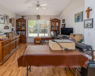 Full office with desk, shelves, and storage cabinet