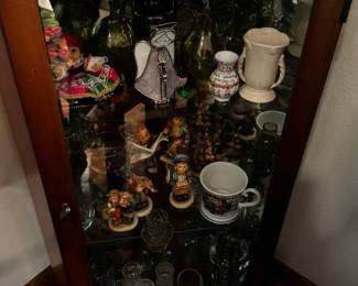 Many collectibles, including vintage Hummels