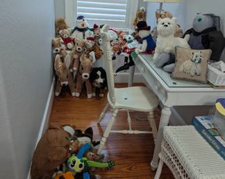 white desk and chair, wicker table, stuffed animals