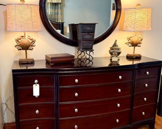 Dresser and beveled round mirror