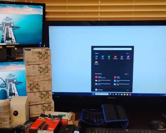 Three screen computer configuration with external hard.drives and processors