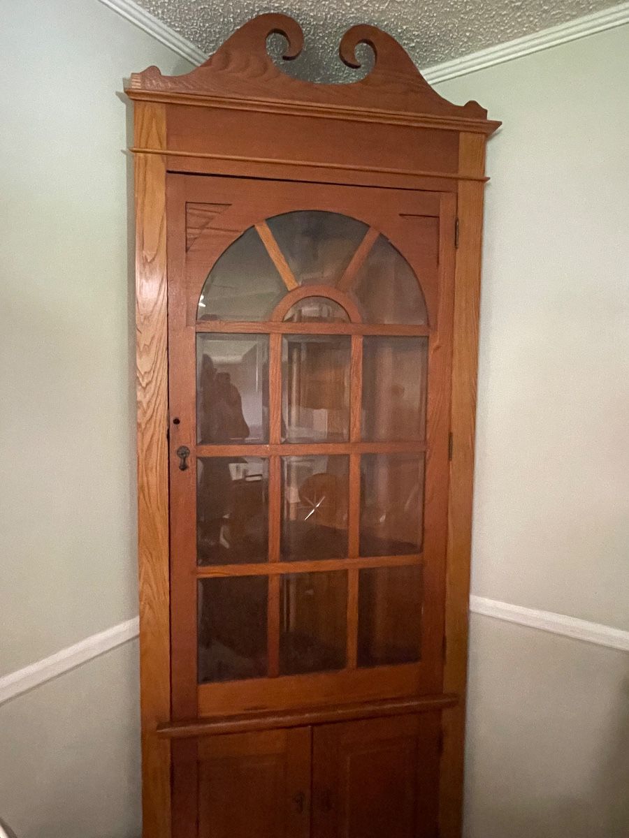 $1,500 primitive style antique corner cupboard with beveled glass panels. 36”w,16”d,8’t