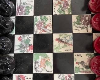 $150.  Beautiful chess board (only), hand painted Asian inspired porcelain tiles with storage drawers - the chess piece are not original to this board