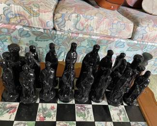 $100 chess pieces only.  Ceramic chess pieces (black and red)