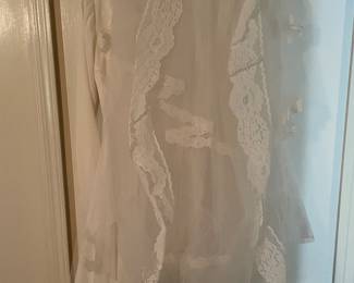 Alfred Angelo (ca. 1970) wedding gown features a distinct beaded neckline and a wrapped bodice detail, has its original slip and veil. ABSOLUTELY BEAUTIFUL!