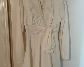 Alfred Angelo (ca. 1970) wedding gown features a distinct beaded neckline and a wrapped bodice detail, has its original slip and veil. ABSOLUTELY BEAUTIFUL!