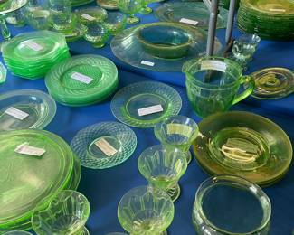 Two 8 foot tables with green (uranium) glass, and yellow glass - different patterns