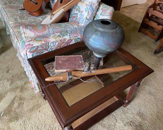 $150  mid century side table with lower rattan shelf