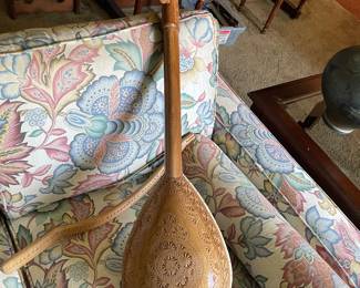 $250.00.  GUSLE, a traditional Balkan single-stringed folk instrument, featuring a carved animal head at the top of the neck.The sound box of this instrument is typically covered with animal skin, such as goat skin, and it is played with a curved bow.