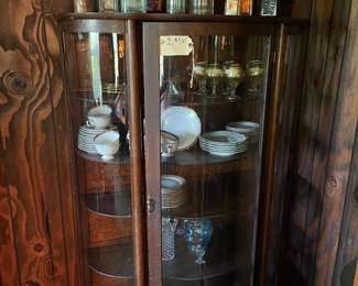 $500 (#2).  Dark wood Victorian claw front bow front cabinet, 5 wood shelves. 41”w,16”d, 65”t