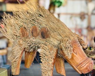 Handcrafted root pig sculpture