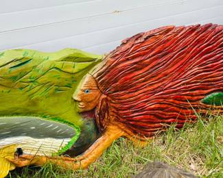 "Mother Nature" chainsaw carving , horizontal flowing form
