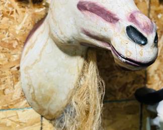 Folk art goat head , beard made from plant fibers 