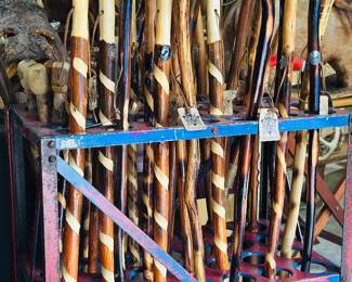 Hundreds of handmade walking sticks , many brand new with tags 