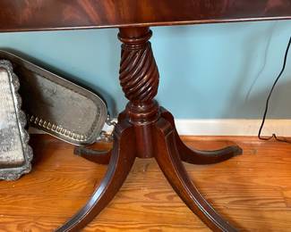 Antique mahogany swivel top game table with carved spiral pedestal base